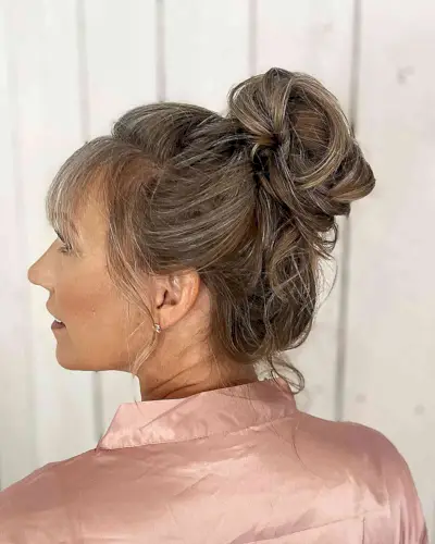 Soft Textured High Bun Updo with Straight Bangs