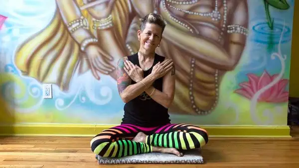 Dana Trixie Flynn performs the Cross Your Heart mudra.