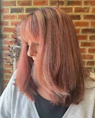 Rose Gold and Auburn Balayage Hair with Bangs