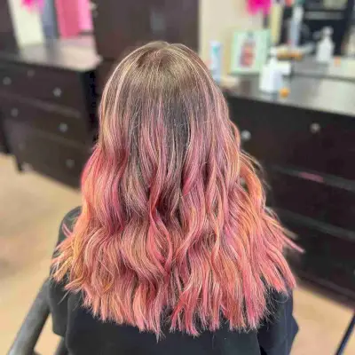 Vivid Rose Gold and Pink Balayage Highlights