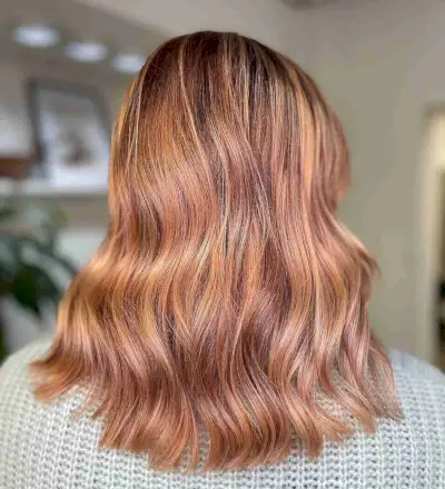 Rose Gold Strawberry Blonde Balayage with Dark Roots