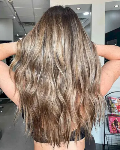 Dark-Rooted Glossy Bronde Balayage for Long Hair with Loose Waves