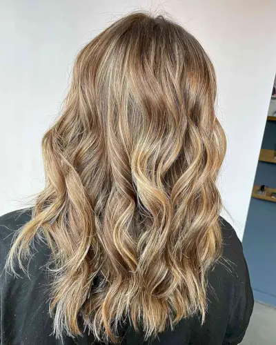 Golden Dirty Bronde Balayage Foilayage with Hints of Copper for Choppy Medium Hair
