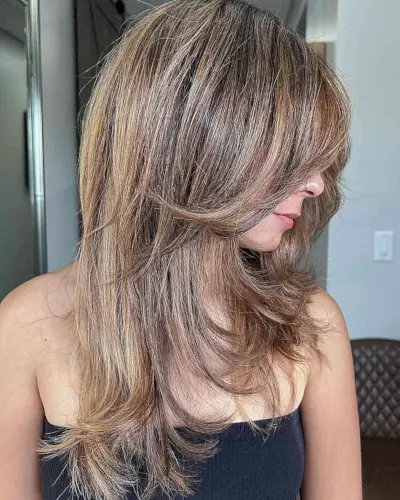 Sandy Bronde Balayage Hair with Medium-Long Layers and Flipped Ends