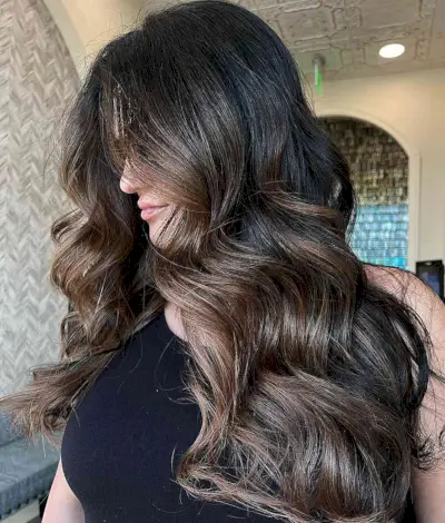 Caramel-Toned Money Piece Balayage for Long Wavy Black Hair
