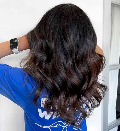 Subtle Balayage with Caramel Hue for Black Mid-Length Hair