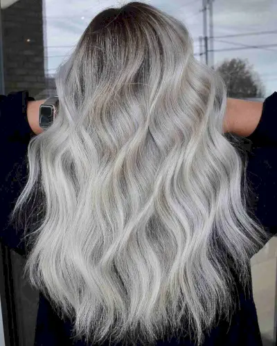Light icy blonde with dark roots hairstyle