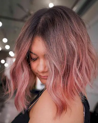 Rooted Rose Gold on a Long Wavy Bob