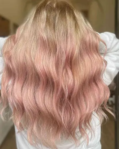 Buttery Blonde base hair color with Light Rose Gold Highlights on long hair