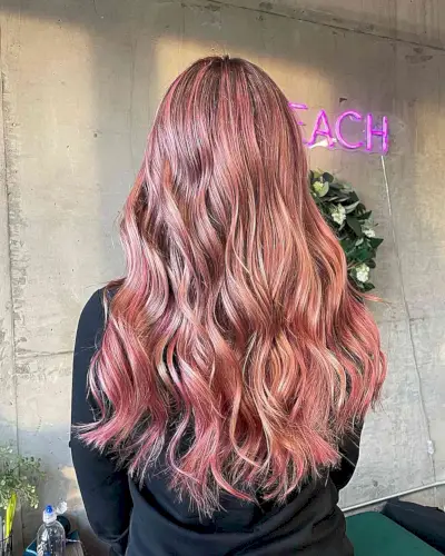 Long Waves with Multi-Dimensional Rose Gold Tones and Darker Roots