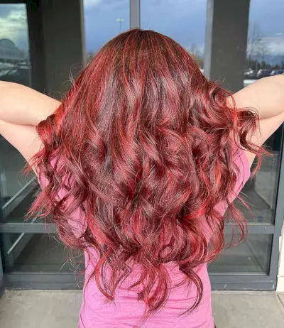 Bright Merlot Red Foilayage for Dark Brown Hair with Long Curls and Waves