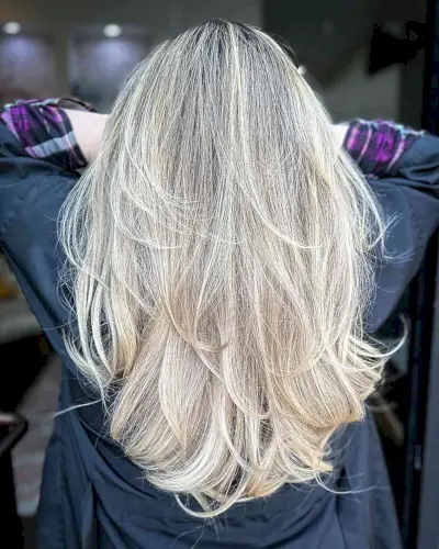Dark-Rooted Creamy Blonde Balayage on Long Layered Hair