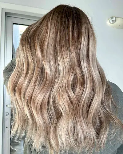 Dimensional Bronde Color Melt with Long Balayage Chunky Waves and Choppy Ends