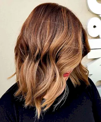 Shoulder-Length Caramel Strawberry Blonde Brown Balayage Hair