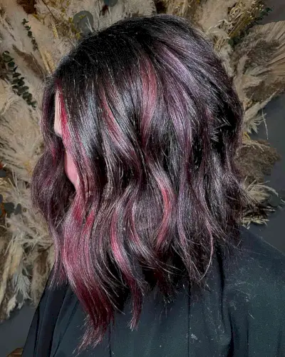 Burgundy Cherry Highlights on Dark-Haired Women with Angled Long Bob Cut