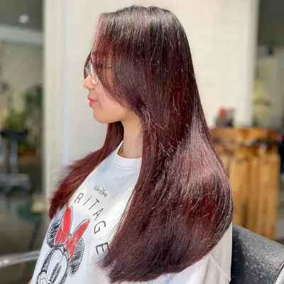 Dark-Rooted Burgundy Babylights for Long Hair with Face-Framing Layers