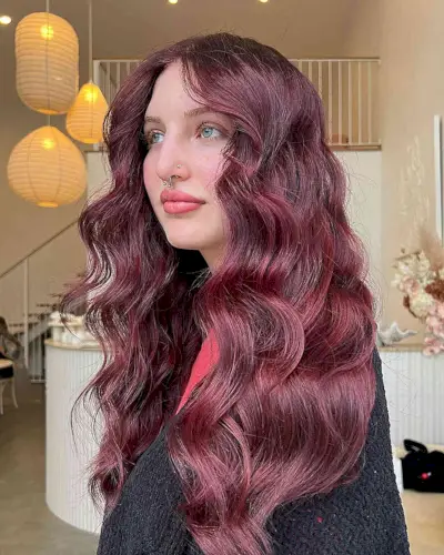 Long Middle-Parted Burgundy Waves on Women with Fair Skin