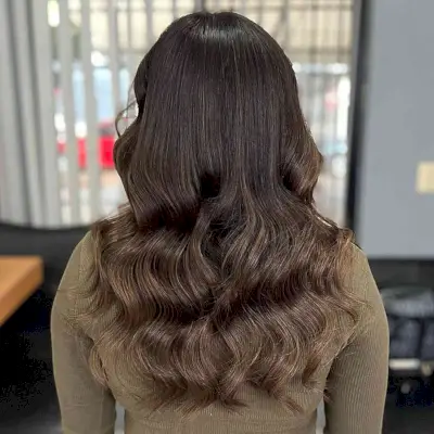 Long Wavy Chocolate Brown Hair Balayage with Lighter Ends