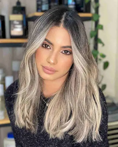 Medium-to-Long Shaggy Blonde Hair with Dark Roots