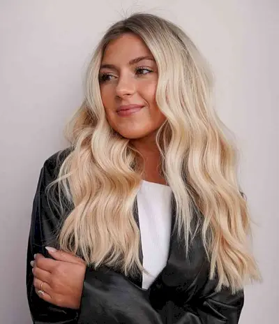 Bright Blonde Ombre with Dark Roots and a Lived-In Wavy Texture