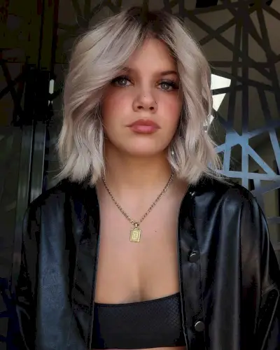 icy blonde hair with stretched dark roots