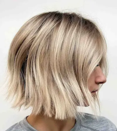 blonde balayage with melted dark roots