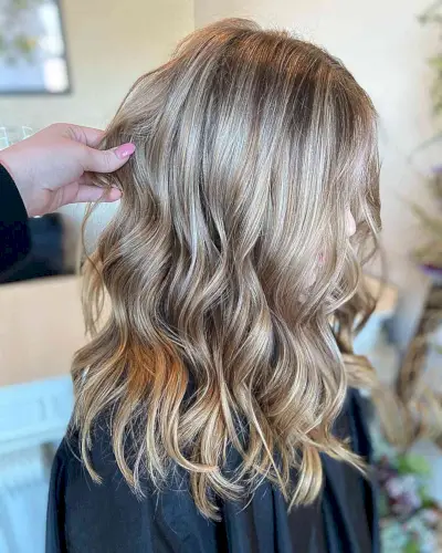 Medium-Length Rich Dirty Bronde Balayage Hair with Waves
