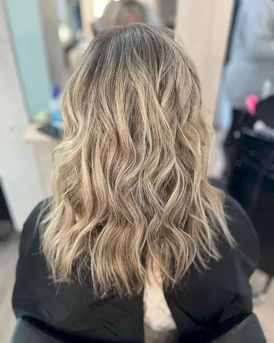 Mid-Length Messy Waves on Dirty Neutral Blonde Balayage and Dark Roots