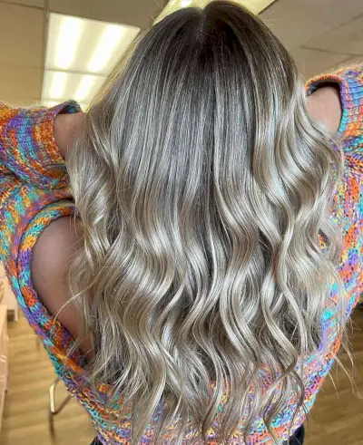 Medium Sandy Dirty Blonde Balayage with Dark Roots and Waves