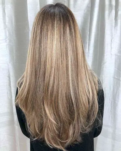 Light Dirty Honey Blonde Balayage Hair with Darker Roots and Long Layers