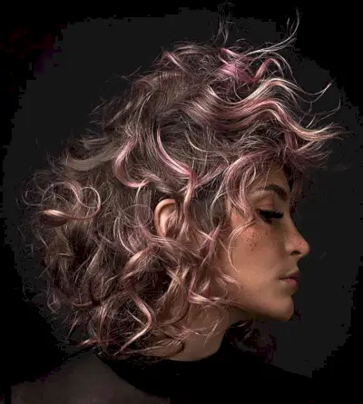 Fluffy Brunette Hair with Pink Highlights for women with a messy hairdo