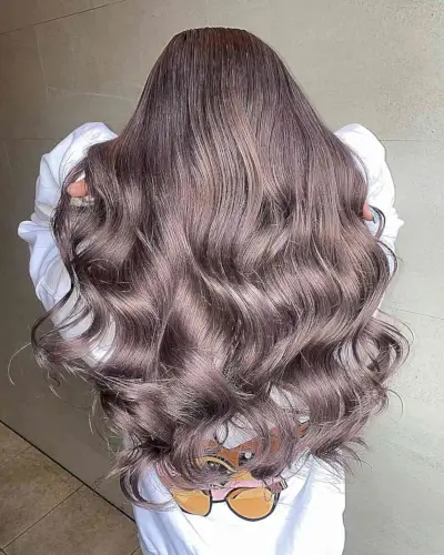 Dusty Brunette Balayage for women with long wavy hair