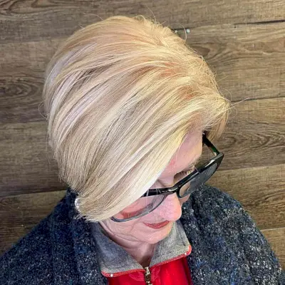 Deep Side-Parted Short Hair with Warm Buttery Blonde Highlights on Older Ladies Over 60