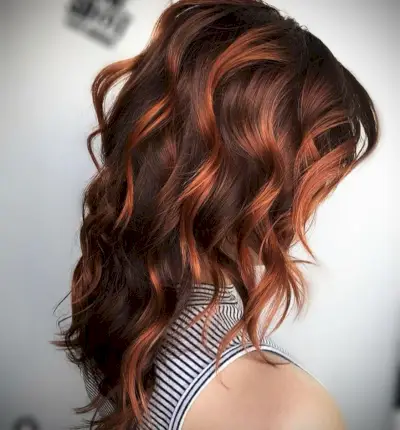 Copper red highlights on light brown hair