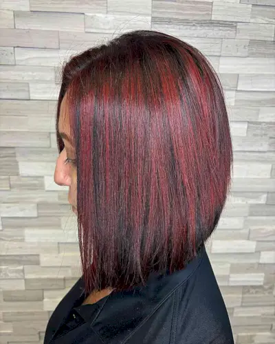 Straight dark brown hair with red highlights