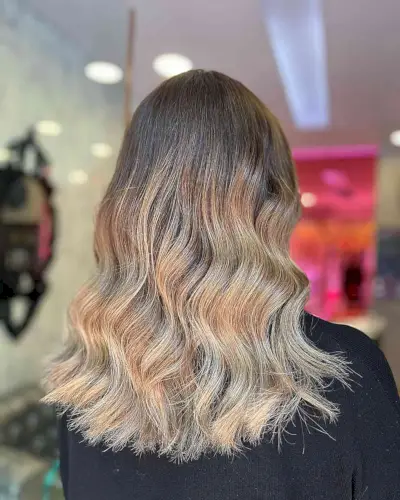 Mid-length Hair with Dark Brown Base and Cool Dark Blonde Balayage Ombre