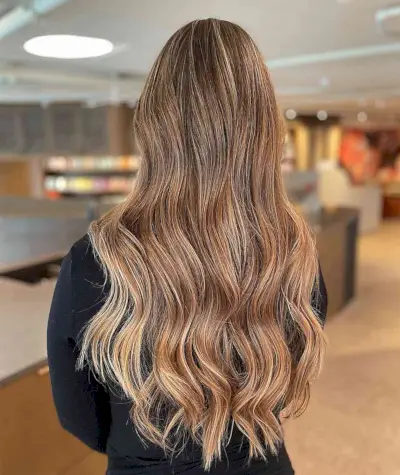 Golden Dark Dirty Blonde Balayage Hair with Long Layers and Waves