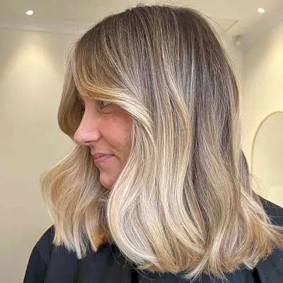 Shoulder-Length Buttery Blonde Balayage Hair with Shadow Root