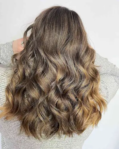 Dimensional Medium Caramel Bronde Balayage Hair with Layered Waves