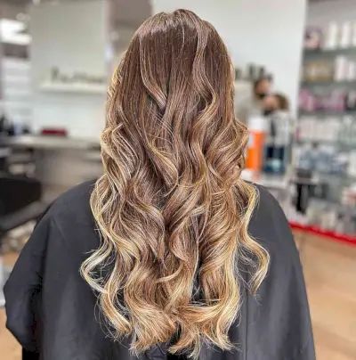 Hot Chocolate Balayage with Milky Accent on Long Blonde Hair with Curls