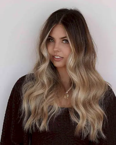 Long Brown Waves with Ashy Blonde Face-Framing Balayage Strands and Mid-Lengths