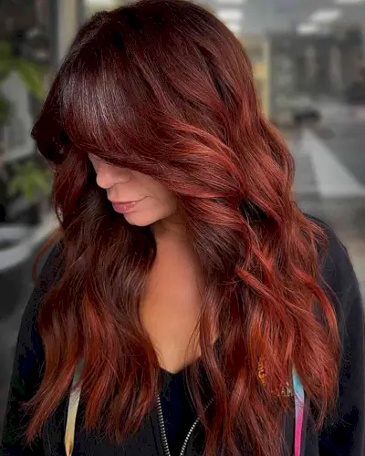 Red and Copper Balayage for women with long wavy hair