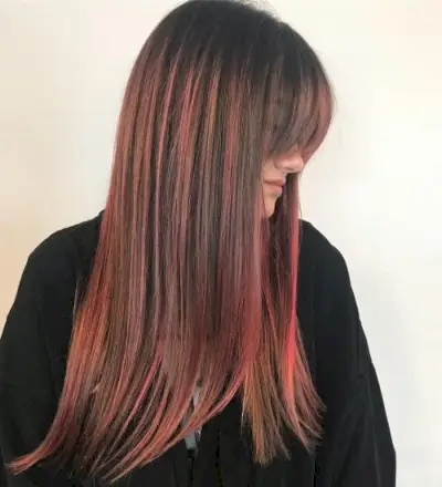 Pastel pink highlights on brown hair