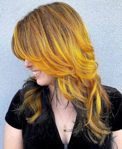 layered hair with a mix of yellow and black color