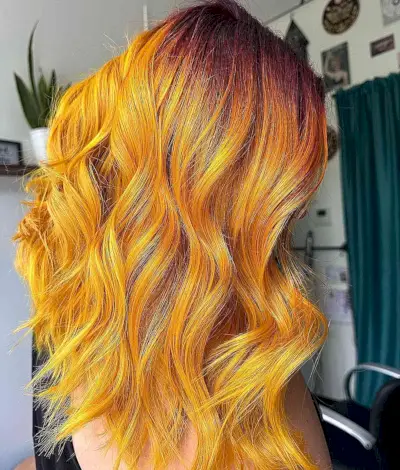Wavy tresses in yellow hair color