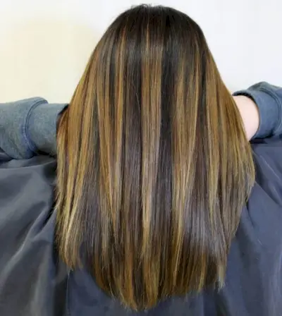 dark brown hair with chunky caramel highlights
