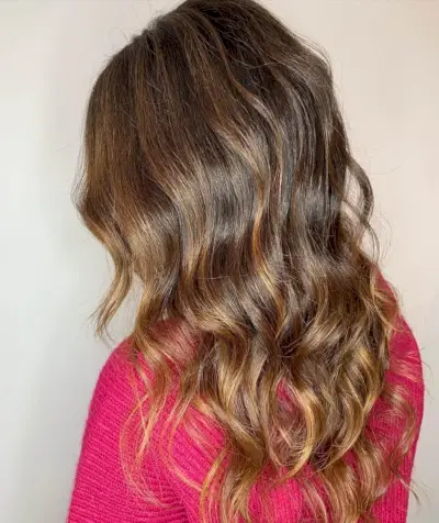 blended dark chestnut brown hair with caramel highlights