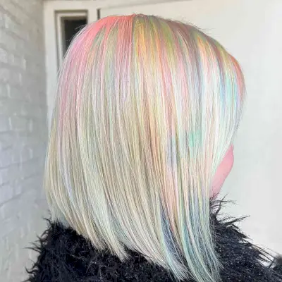 Light Blonde Neck-Length Hair with Hints of Cotton Candy Pink and Green