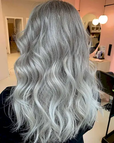 Ice Platinum Blonde Tones on Wavy Light Brown Hair with Airtouch Balayage Technique