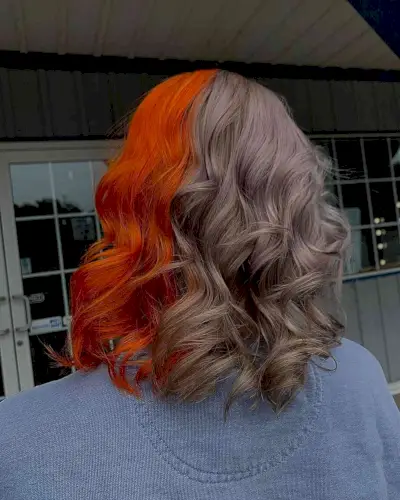 Bright Orange and Mushroom Silver Split Dye on Shoulder-Length Hair